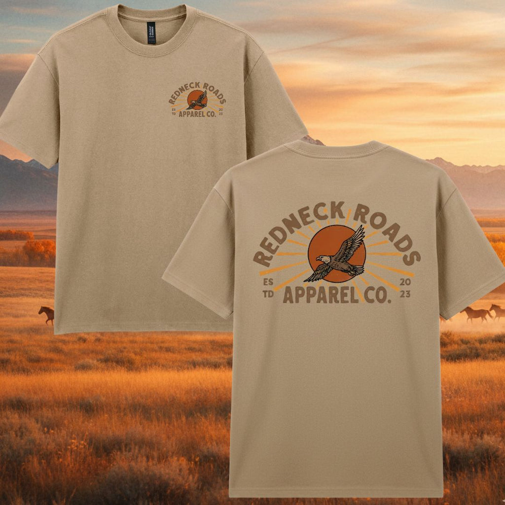 Beige t-shirt with 'Redneck Roads Apparel Co.' logo on a scenic background