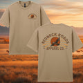Beige t-shirt with 'Redneck Roads Apparel Co.' logo on a scenic background