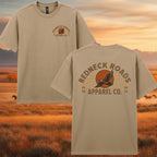 Beige t-shirt with 'Redneck Roads Apparel Co.' logo on a scenic background