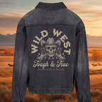 Denim jacket with 'Wild West Tough & True' design against a scenic backdrop